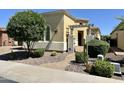 Inviting home with desert landscaping, decorative pergola over the entry, and lovely curb appeal at 562 E Vesper Trl, Queen Creek, AZ 85140