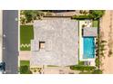 Aerial view of the backyard featuring a pool, landscaped areas, and a covered patio at 7002 S Portland Ave, Gilbert, AZ 85298