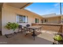 Private patio area with a table set, perfect for outdoor dining and relaxation at 10895 W Clair Dr, Sun City, AZ 85351