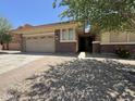 Beautiful single-Gathering home with a two-car garage and appealing brick accents at 11249 N 161St Ave, Surprise, AZ 85379