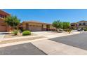 Charming single-story home with well-manicured front yard and a two-car garage at 11249 N 161St Ave, Surprise, AZ 85379