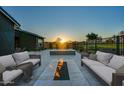 Outdoor fire pit and seating area, great for relaxing and entertaining guests at 11534 N Jerome St, Surprise, AZ 85388