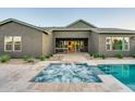Inviting spa flows into the pool, great outdoor space for relaxing and entertaining at 11534 N Jerome St, Surprise, AZ 85388