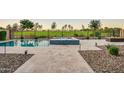 Inviting pool and spa area with blue tiled accents and beautiful desert view at 11534 N Jerome St, Surprise, AZ 85388