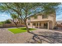 Expansive backyard with a pristine green turf area, surrounded by a well maintained and tidy landscape at 1239 W Descanso Canyon Dr, Casa Grande, AZ 85122