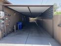 A covered carport providing ample parking with the home's exterior and utilities visible at 15625 N Jerry St, Surprise, AZ 85378