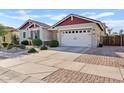 Well-maintained home features a white garage door, neutral color scheme, and a beautifully landscaped front yard at 19748 E Walnut Rd, Queen Creek, AZ 85142