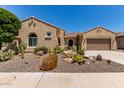 Charming front exterior with desert landscaping including cacti and a low-maintenance gravel yard at 20655 N 273Rd Ave, Buckeye, AZ 85396