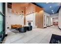 Lobby with contemporary seating, modern fireplace, and a stylish combination of colors and textures at 310 S 4Th St # 601, Phoenix, AZ 85004