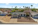 Charming single-story home with a two-car garage, low-maintenance landscaping, and desert surroundings at 4415 S Poplar St, Tempe, AZ 85282