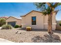 Street view of a well maintained single-Gathering home with desert landscaping, offering curb appeal at 4520 N 151St Dr, Goodyear, AZ 85395