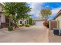 Charming single-story home features a long driveway and meticulously manicured front yard at 6300 S Nash Way, Chandler, AZ 85249