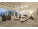 Spacious main bedroom with ceiling fan and many windows at 6481 E Amber Sun Dr, Scottsdale, AZ 85266
