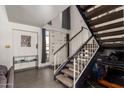 Bright entryway with staircase and access to the upper level of the home, complemented by tile flooring at 6531 N 10Th Pl, Phoenix, AZ 85014