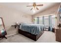 Bright main bedroom featuring a vaulted ceiling, lots of natural light, and carpeted floors at 8622 W Shaw Butte Dr, Peoria, AZ 85345