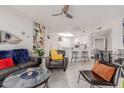 Cozy living room with comfortable seating, stylish decor, and a seamless flow into the kitchen at 10030 W Indian School Rd # 215, Phoenix, AZ 85037
