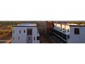 Modern townhome complex featuring various color schemes and convenient parking spaces with a city view at 120 W Milada Dr, Phoenix, AZ 85041