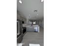 Spacious kitchen with stainless steel appliances and an open layout at 14860 S Capistrano Rd, Arizona City, AZ 85123