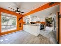 Bright kitchen with granite counters, white cabinets, modern appliances and wood-look tile at 1500 N Markdale -- # 68, Mesa, AZ 85201