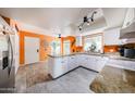 Updated kitchen features granite counters, white cabinets, wood-look tile and stainless fridge at 1500 N Markdale -- # 68, Mesa, AZ 85201