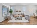 Cozy living room with hardwood floors, neutral walls, and large windows that let in plenty of natural light at 16608 S 16Th Ave, Phoenix, AZ 85045