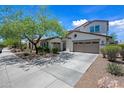 Attractive two-story home featuring a neutral color palette, well-maintained landscaping, and an attached two-car garage at 17966 W Agave Rd, Goodyear, AZ 85338