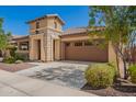 Delightful single-Gathering home featuring a two-car garage, stone accents, and xeriscaped landscaping at 20499 W Alsap Rd, Buckeye, AZ 85396