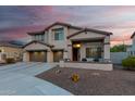 Charming two-story home with a three-car garage and low maintenance front yard at 2336 W Laredo Ln, Phoenix, AZ 85085