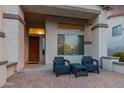 Inviting front porch with seating area and a clear view of the entrance at 2336 W Laredo Ln, Phoenix, AZ 85085