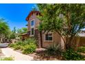 Well-maintained home with stone accents, desert landscaping, and a brick walkway at 2547 E Vermont Dr, Gilbert, AZ 85295