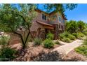 Beautiful two-story home with desert landscaping and a welcoming walkway to the front door at 2547 E Vermont Dr, Gilbert, AZ 85295