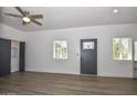 Bright living space boasting wood floors, a modern front door, and ample natural light at 3831 N 8Th St, Phoenix, AZ 85014