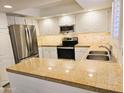 Spacious kitchen featuring granite countertops, stainless steel appliances and double sink at 4303 E Cactus Rd # 135, Phoenix, AZ 85032