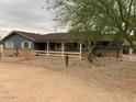 Inviting single-story home featuring a covered front porch and simple desert landscaping at 6841 E Vista Dr, Paradise Valley, AZ 85253