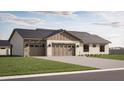 New home with three-car garage and paved driveway, offering ample parking at 11263 E Crescent Ave, Mesa, AZ 85208