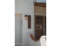 Close-up of the house number (1452) and a stylish exterior light fixture at 1452 E Gary St, Mesa, AZ 85203