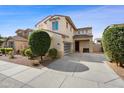 Charming two-story home showcasing a neat front yard and a practical two-car garage at 1502 E Goldcrest St, Gilbert, AZ 85297