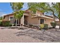 Charming two-story home with a well-manicured desert landscape and a welcoming entrance at 15235 S 30Th St, Phoenix, AZ 85048