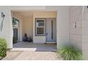 Inviting covered front porch with stylish planters, modern lighting, and a well-maintained walkway at 1555 E Ocotillo Rd # 16, Phoenix, AZ 85014