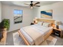 Cozy main bedroom with a queen bed and soft, natural lighting at 16236 W La Ventilla Way, Goodyear, AZ 85338
