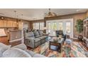 Comfortable living room with plush seating and access to outdoor patio at 279 W Stirrup Ln, San Tan Valley, AZ 85143