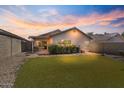 Spacious backyard with artificial grass, perfect for outdoor entertaining at 3338 E Lavey Ln, Phoenix, AZ 85032