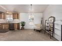 Bright and inviting living space with decorative chandelier and modern furnishings at 37334 N 17Th Ave, Phoenix, AZ 85086