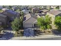 An aerial shot of a charming house with desert landscaping and an expansive roof at 37390 W Merced St, Maricopa, AZ 85138