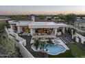 Aerial view of luxurious home featuring a pool, spa, patio, and stunning desert landscape at 9441 N 129Th Pl, Scottsdale, AZ 85259