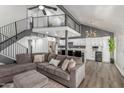 Open floor plan with a spacious living room that includes a modern kitchen and staircase to the second story at 1174 E Belmont Ave, Phoenix, AZ 85020