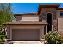 Beautiful home exterior featuring a two-car garage and well-maintained landscaping at 16800 E El Lago Blvd # 2076, Fountain Hills, AZ 85268