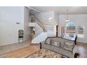 Inviting living room with tile floors and staircase leading to second floor at 1711 W Houston Ave, Gilbert, AZ 85233