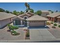 Beautiful single-story home with tile roof, desert landscaping, and an attached two-car garage at 1741 S Clearview Ave # 13, Mesa, AZ 85209
