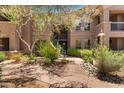 Multi-level apartment building featuring well-maintained landscaping, trees, and walkways at 20801 N 90Th Pl # 255, Scottsdale, AZ 85255